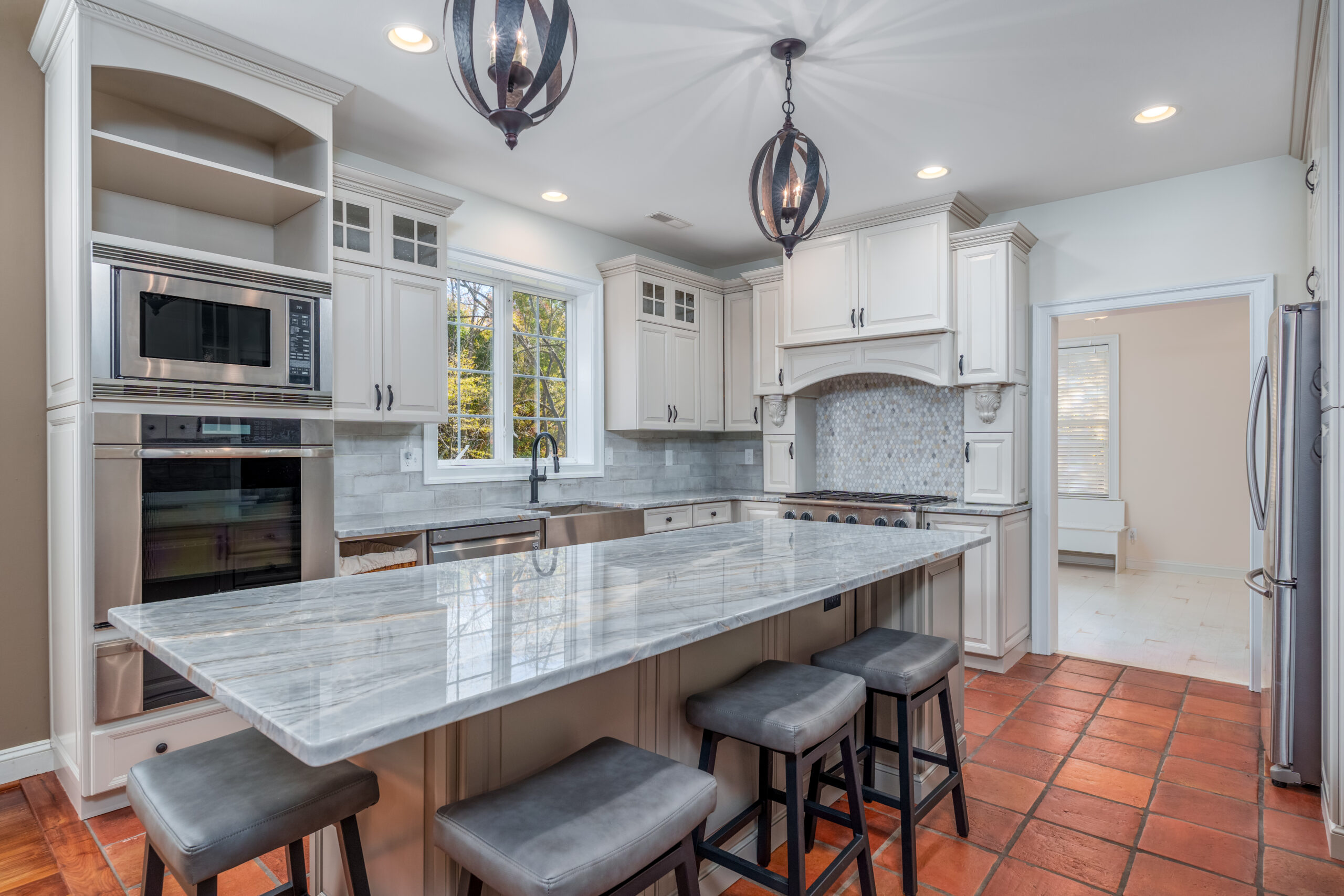Kitchen remodeling trends in Delaware, Pennsylvania, and Maryland with modern white cabinets and large island