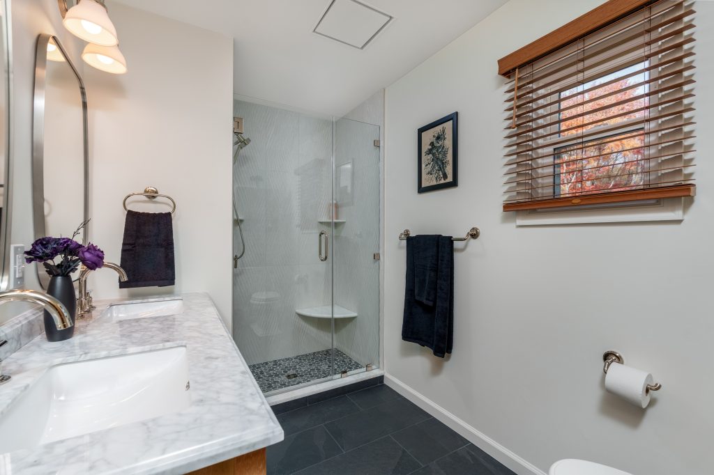 North Wilmington Bathroom Remodel – After Completed bathroom remodel in North Wilmington, DE with glass shower, double vanity, and updated flooring