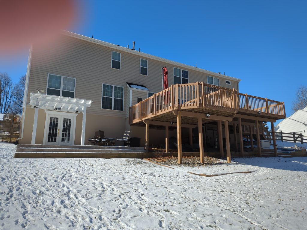 How to Choose a Home Remodeling Contractor in Hockessin, DE 1 Existing elevated wood deck before a two-level composite deck remodel in Newark, DE