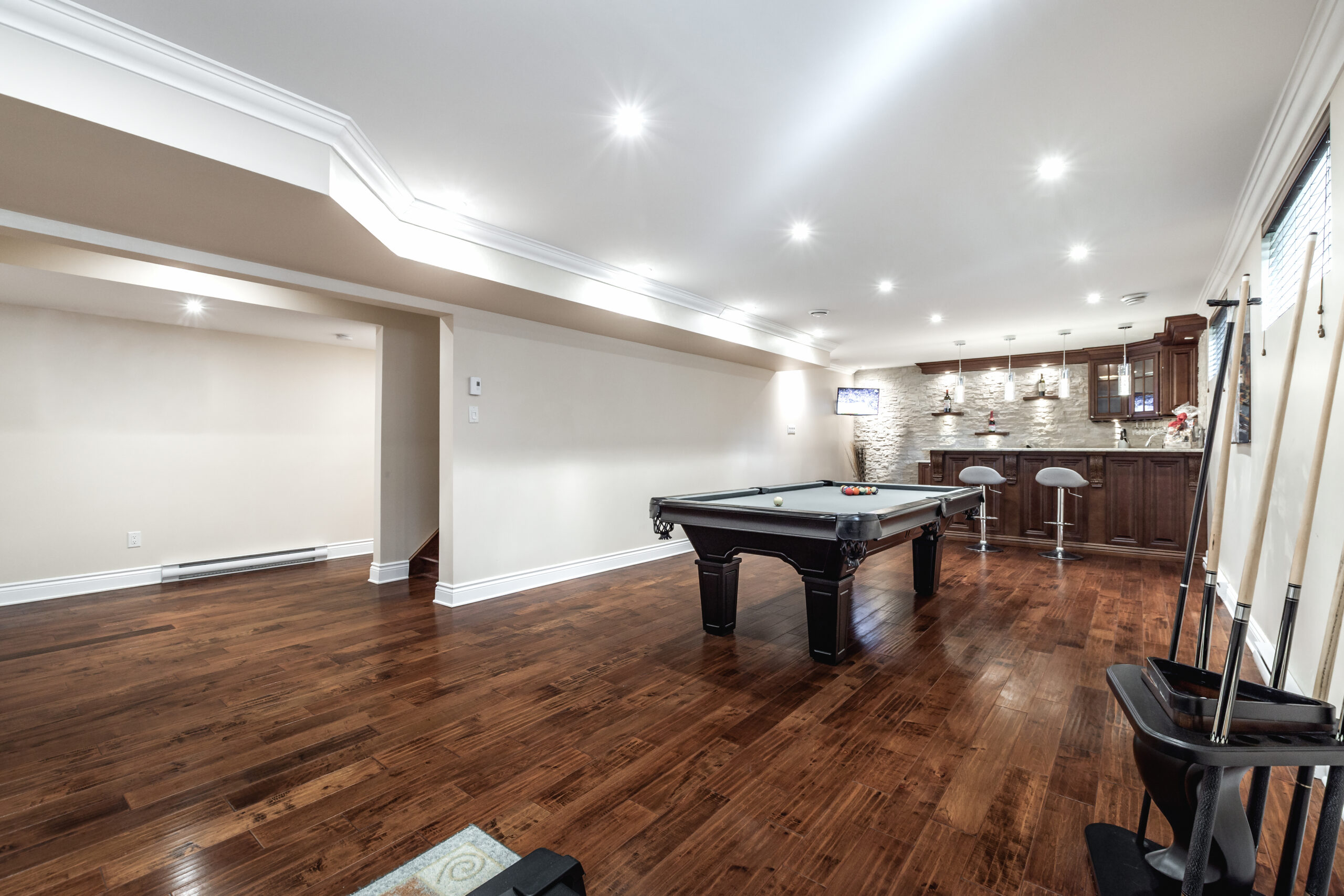 basement finishing vs basement remodeling finished basement with billiard table